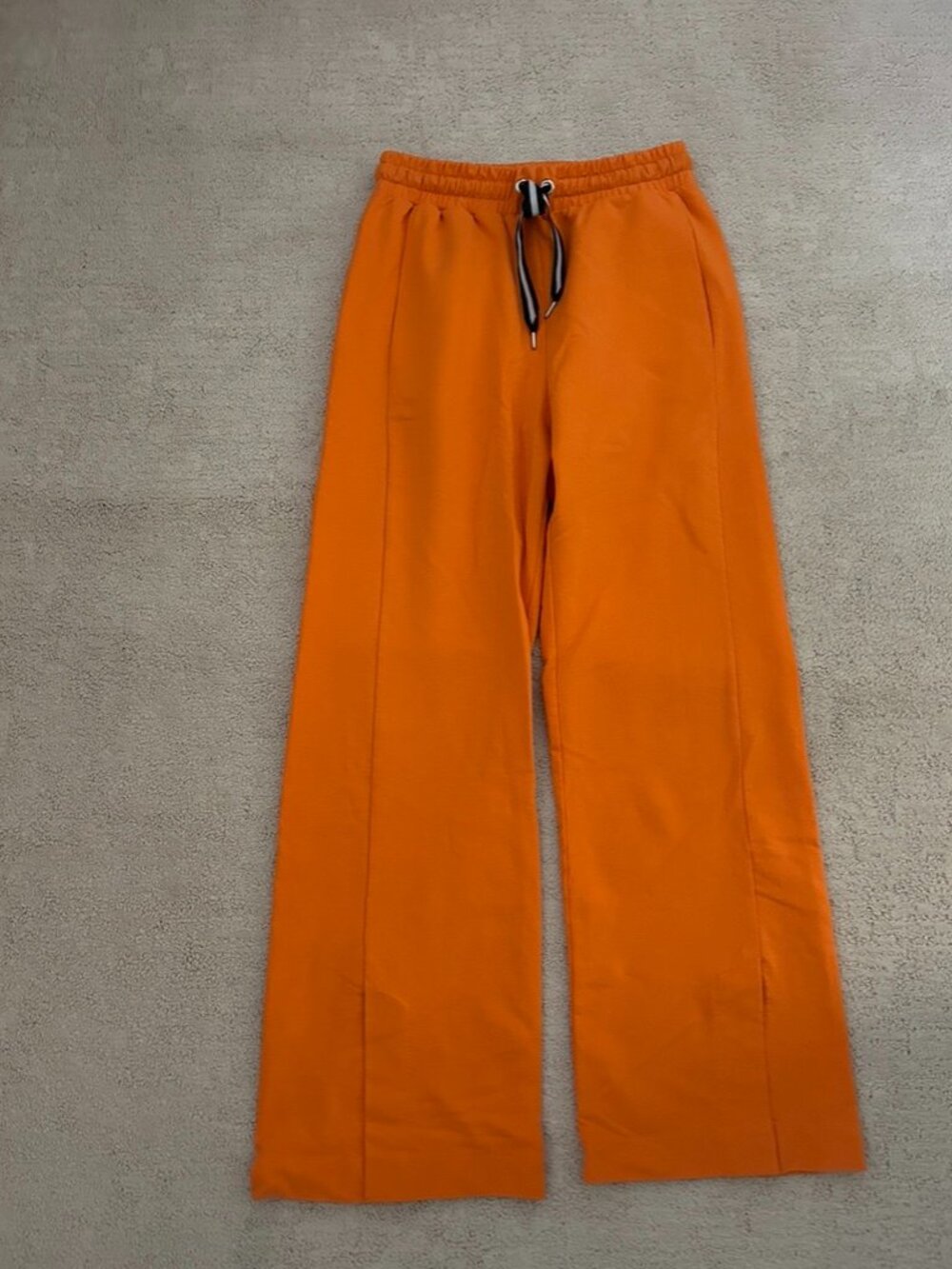 Orange track pants